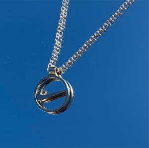 floating swoosh necklace