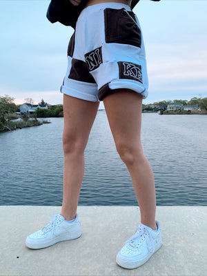 brown & white nike patchwork shorts