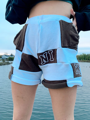 brown & white nike patchwork shorts