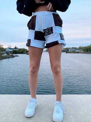 brown & white nike patchwork shorts