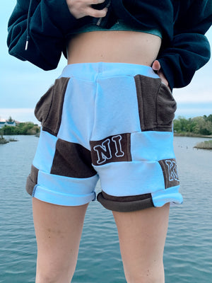 brown & white nike patchwork shorts